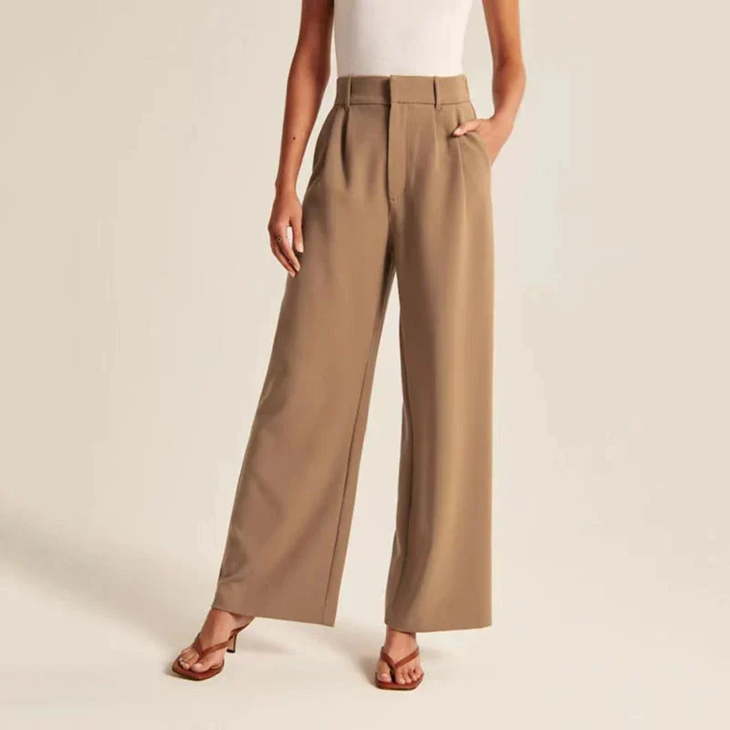 Cream high-waisted wide-leg trousers for women by Lumina Wear, styled with a relaxed fit and elegant silhouette.