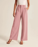 Cream high-waisted wide-leg trousers from Lumina Wear's Marieke collection, styled for a chic, modern look for women.