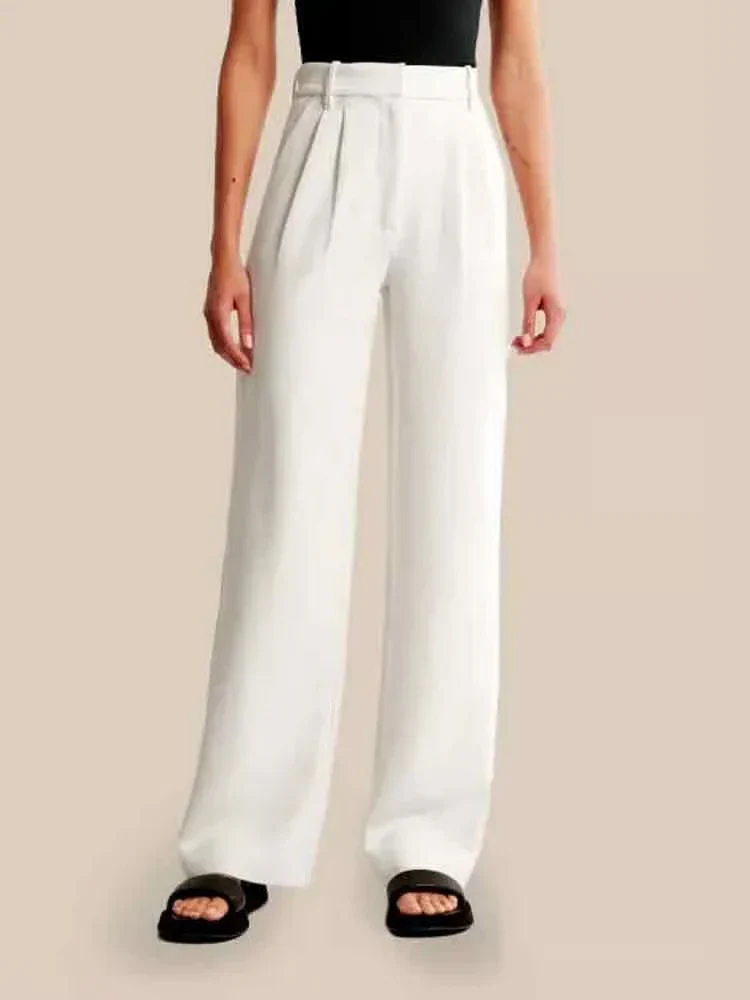 Cream high-waisted wide-leg women's trousers by Lumina Wear, styled with a relaxed fit and modern silhouette.