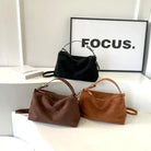 Marielle textured minimalist shoulder bag with curved shape by Lumina Wear, in coffee color, stylish and modern handbag.