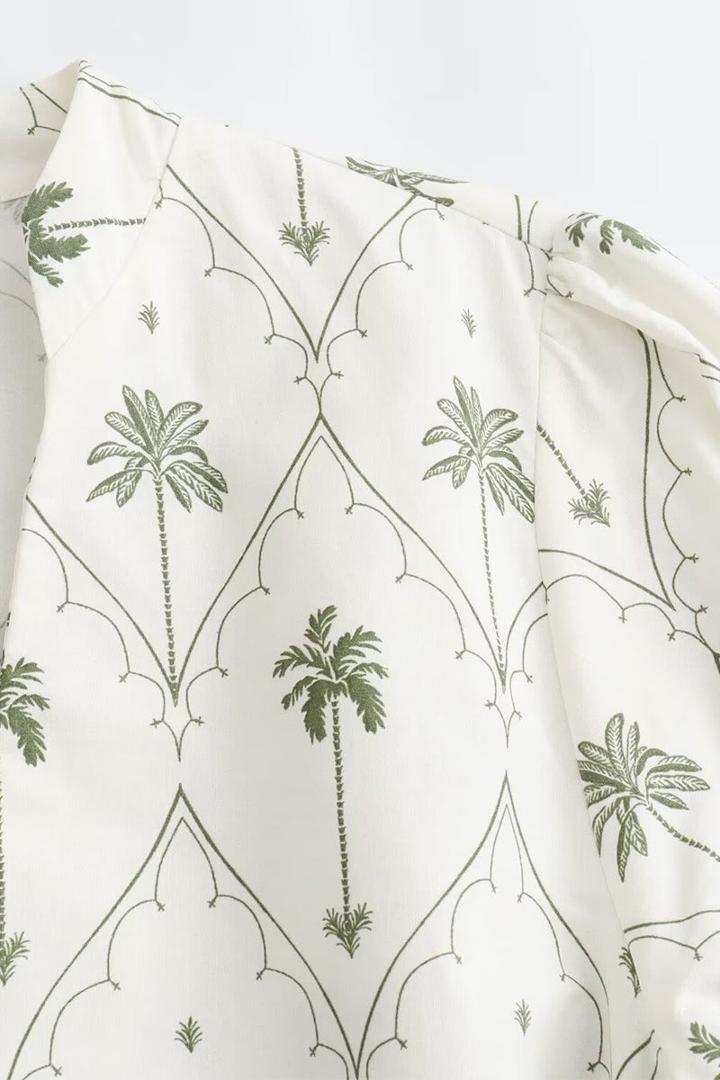 White and green Marin Willow wrap mini dress with V-neck by Lumina Wear, featuring a stylish, flowy design and tie waist.