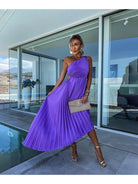 Purple Marjorie Lumina Vancouver elegant one-shoulder midi dress displayed on a mannequin with draped fabric and stylish design.
