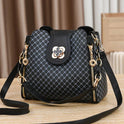 Black Lumina Wear Marjorie quilted handbag with adjustable strap, featuring elegant charm detailing and compact design.