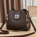 Black Marjorie Lumina Wear quilted charm handbag with adjustable strap, elegant design and structured silhouette.