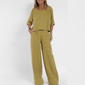 Light gray Lumina Wear set featuring a relaxed fit coordinated outfit with matching top and pants, casual and comfortable.