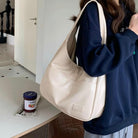 Black Lumina Wear Maya shoulder bag with spacious design and vegan leather, stylish and practical for everyday use.