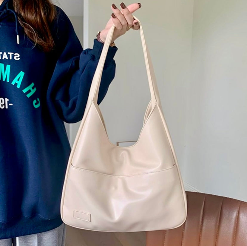 Black Maya Lumina Wear shoulder bag with spacious design and chic vegan leather, ideal for stylish everyday use.