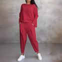 Black Maya flowy lounge set with tapered pants by Lumina Wear, shown on a woman, comfortable and stylish loungewear.