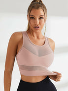 Black Mesh Shockproof Sports Bra by Lumina Vancouver, designed for comfort and support during athletic activities.