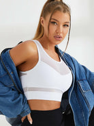 White Lumina Vancouver mesh shockproof sports bra with supportive design and breathable fabric for active wear.