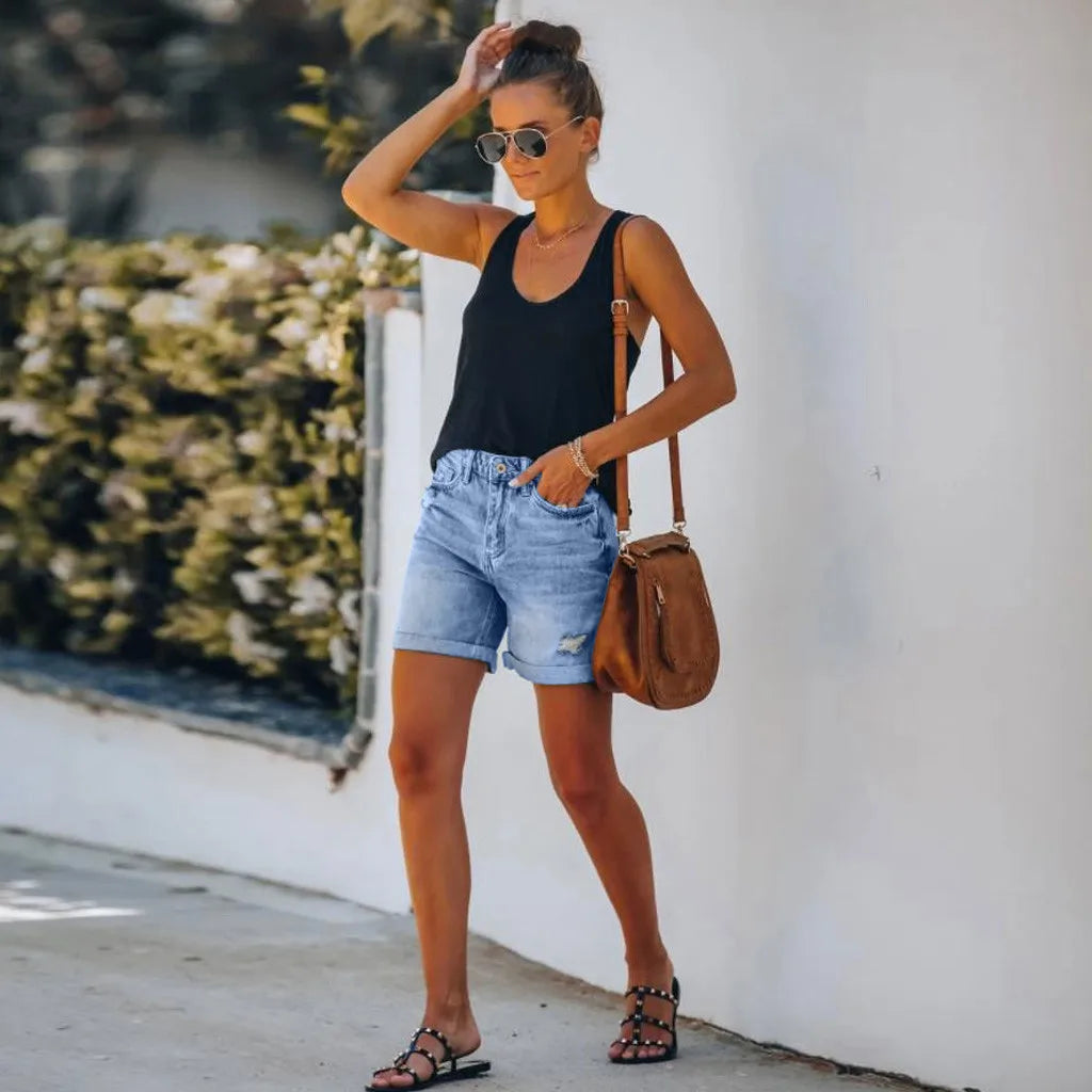 Light blue high-waisted denim shorts with rolled hem from Lumina Wear, styled with casual fit and trendy design.