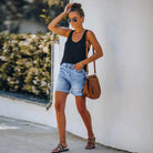 Light blue high-waisted denim shorts with rolled hem from Lumina Wear, styled with casual fit and trendy design.