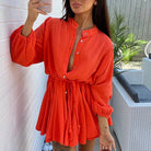 Green Sade button-up mini dress with tie waist by Lumina Vancouver, featuring a stylish and flattering design.