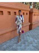 Elegant Lumina Vancouver Ilta Elegant Midi dress in size S displayed on a hanger with a sleek, sophisticated design.