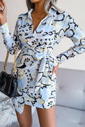 White Mira V-neck wrap mini dress with tie waist by Lumina Wear, showcasing elegant style and flattering fit.