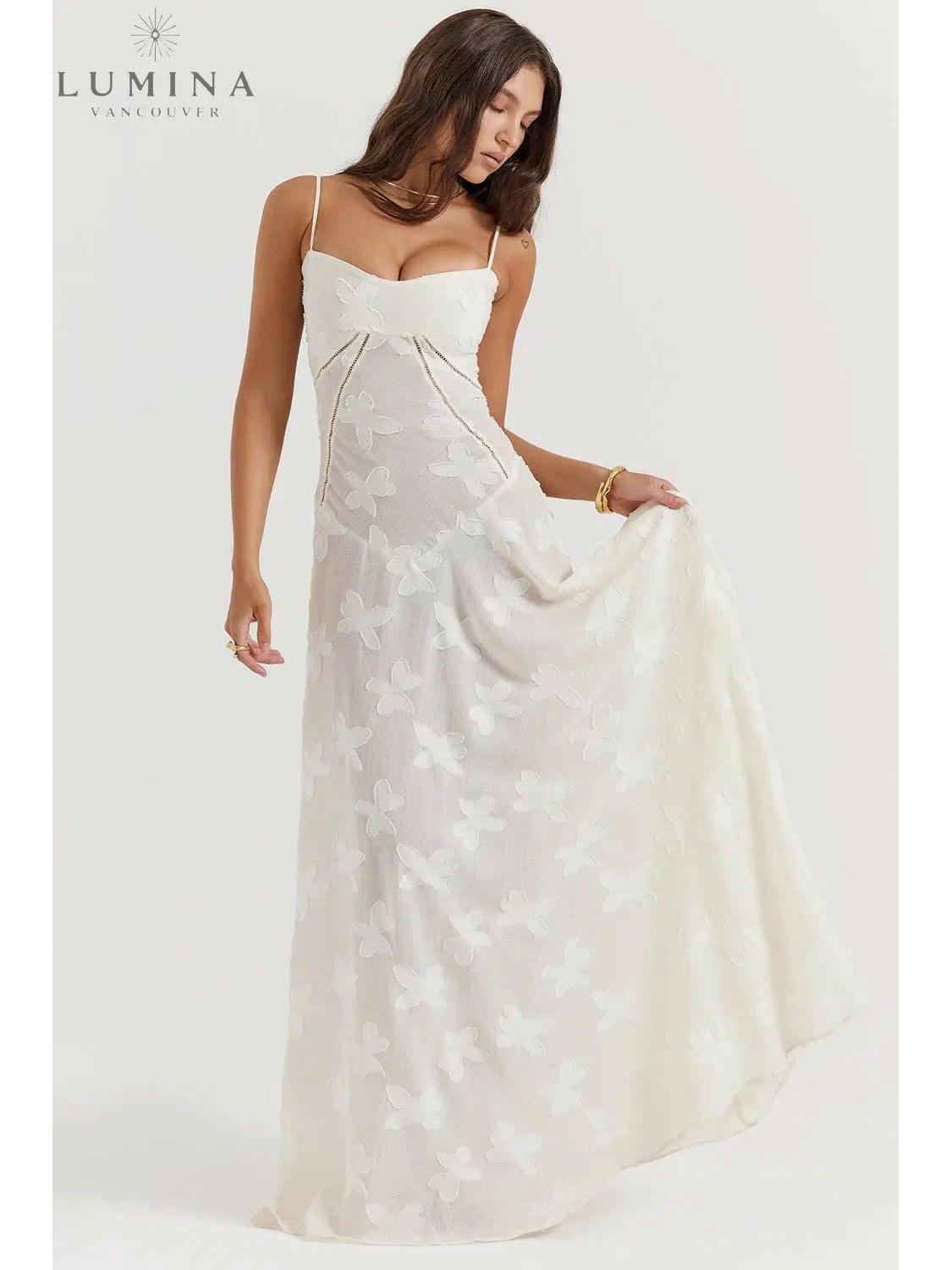 White Mireille Romantic Summer Dress by Lumina Vancouver featuring a flowy design perfect for holiday vibes and summer outings.