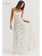 White Mireille Romantic Summer Dress by Lumina Vancouver featuring a flowy design perfect for holiday vibes and summer outings.