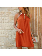 Orange Miya™ fashionable halter dress by Lumina Vancouver, showcasing stylish design and elegant fit.