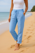 Beige Lumina Wear Monica pants with elastic waistband, comfortable fit, tailored for casual wear, shown on a model.
