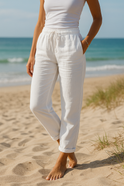 Beige Lumina Wear Monica pants with elastic waistband, comfortable fit, shown in size S, featuring sleek, casual design.