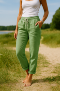 Beige Monica Lumina Wear trousers with elastic waistband, comfortable fit, casual style, shown on a model.
