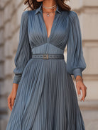 Steel blue Gwenna maxi dress by Lumina Wear with pleated midi style, flowing fabric, and elegant design.