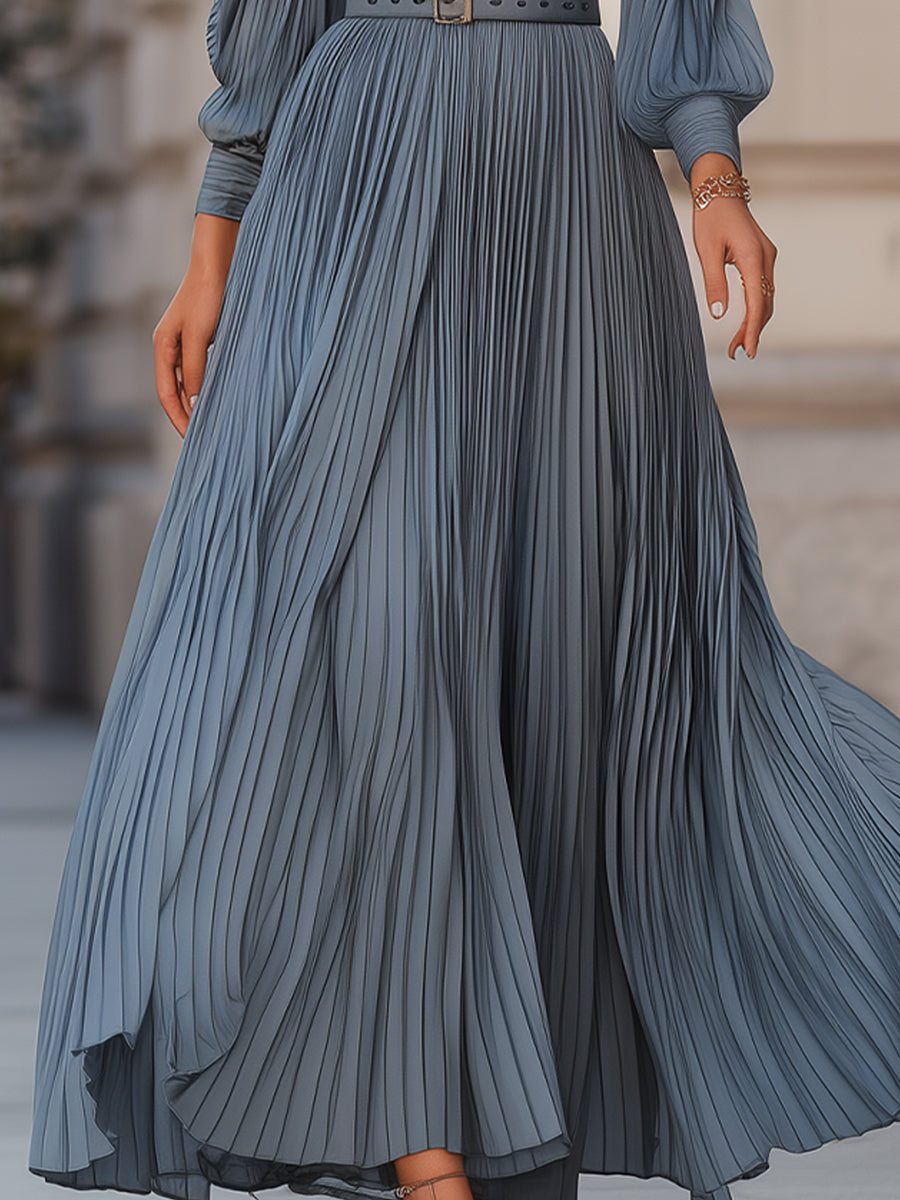 Steel blue pleated midi dress by Lumina Wear, featuring a flowy maxi design with a fitted waist and elegant pleats.