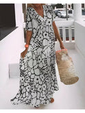 Green Myrtle Relaxed Summer Dress by Lumina Wear, lightweight fabric, casual fit, perfect for warm weather, displayed on a hanger.
