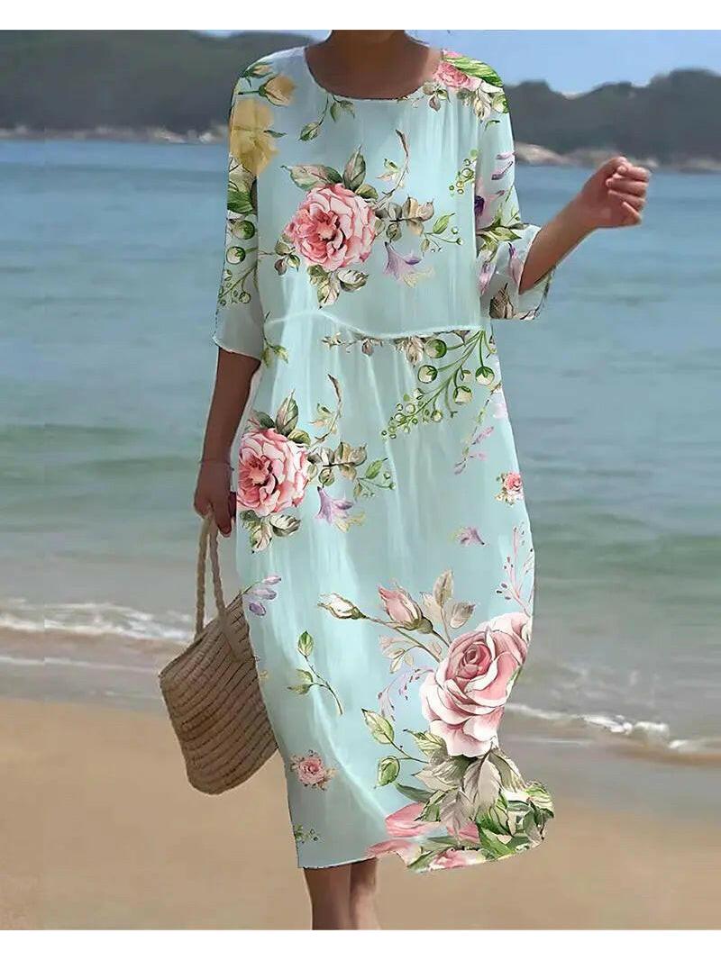 Blue Naia floral dress by Lumina Vancouver, featuring a stylish, elegant design with floral patterns and a flattering fit.