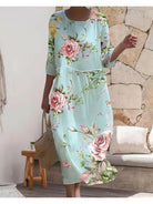 Blue Naia floral dress by Lumina Vancouver, featuring an elegant design with a stylish, feminine silhouette.