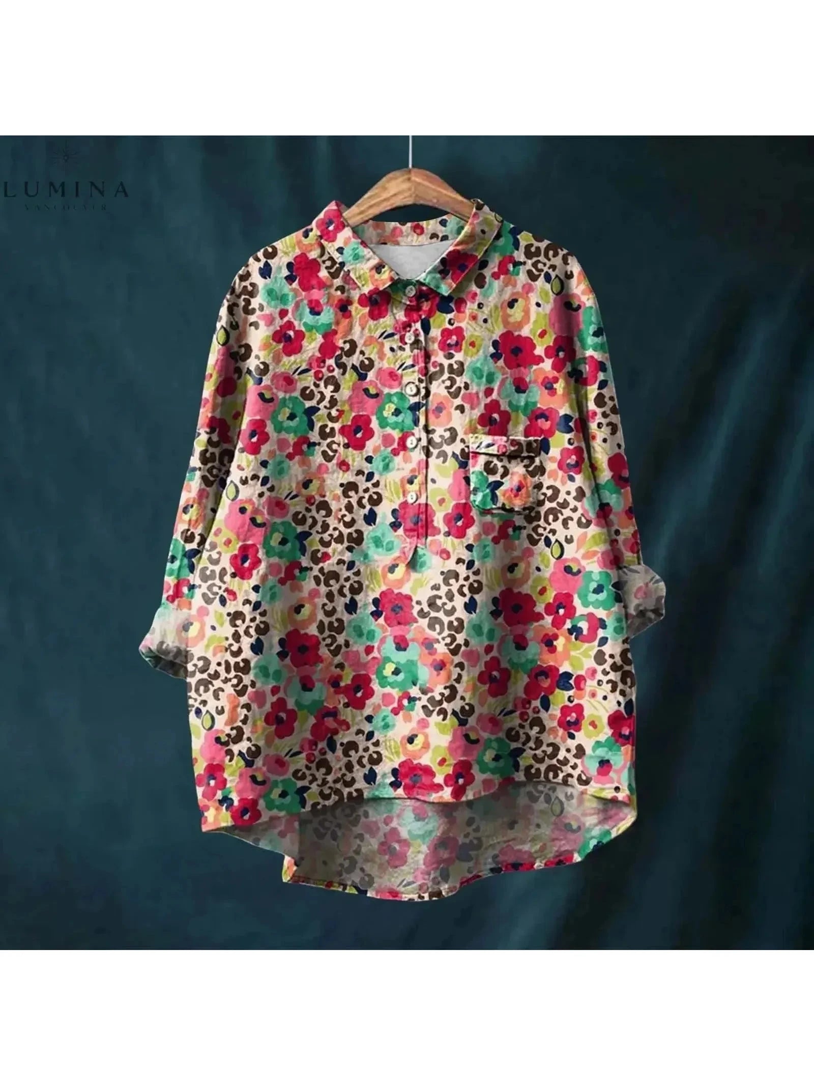Gray floral blouse named Natasha by Lumina Wear featuring elegant art-inspired floral print, shown on a model.