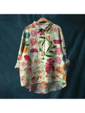 Gray Natasha Art Elegant Floral blouse by Lumina Wear, featuring a stylish floral design and a classic blouse silhouette.