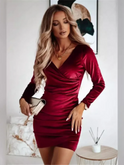 Black Lumina Nia velvet wrap mini dress with V-neck and long sleeves, showcased on a model.