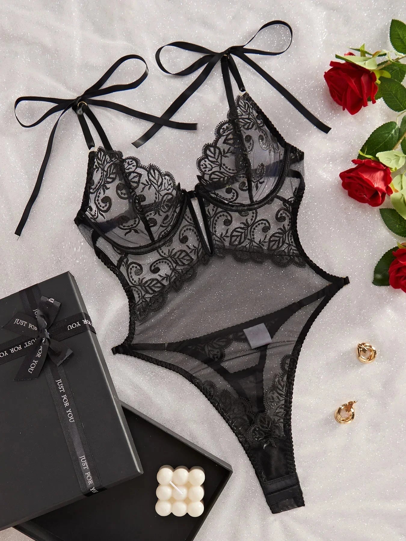 Noemi S bodysuit by Lumina Vancouver, fitted black bodysuit with long sleeves and sleek design.