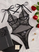 Noemi S bodysuit by Lumina Vancouver, fitted black bodysuit with long sleeves and sleek design.