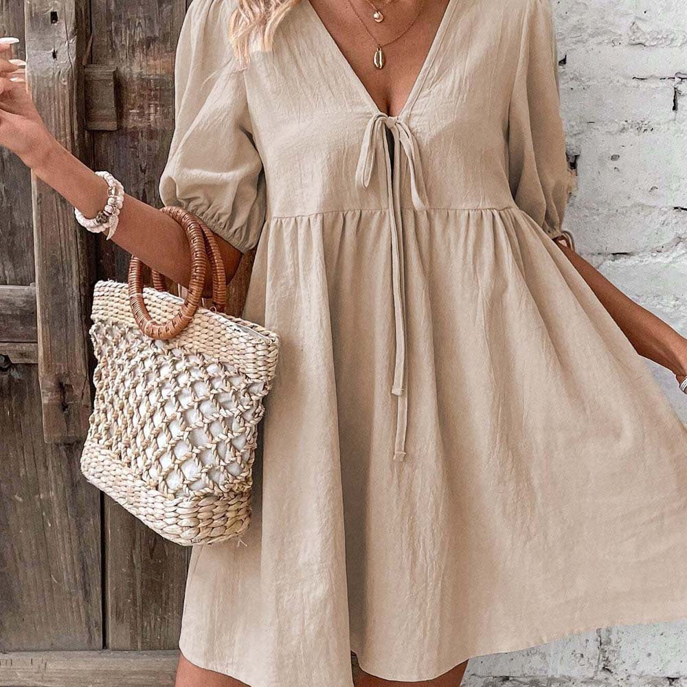Alys Lumina Vancouver khaki A-line mini dress with deep V-neck, sleeveless design, and fitted waist for a stylish, casual look.