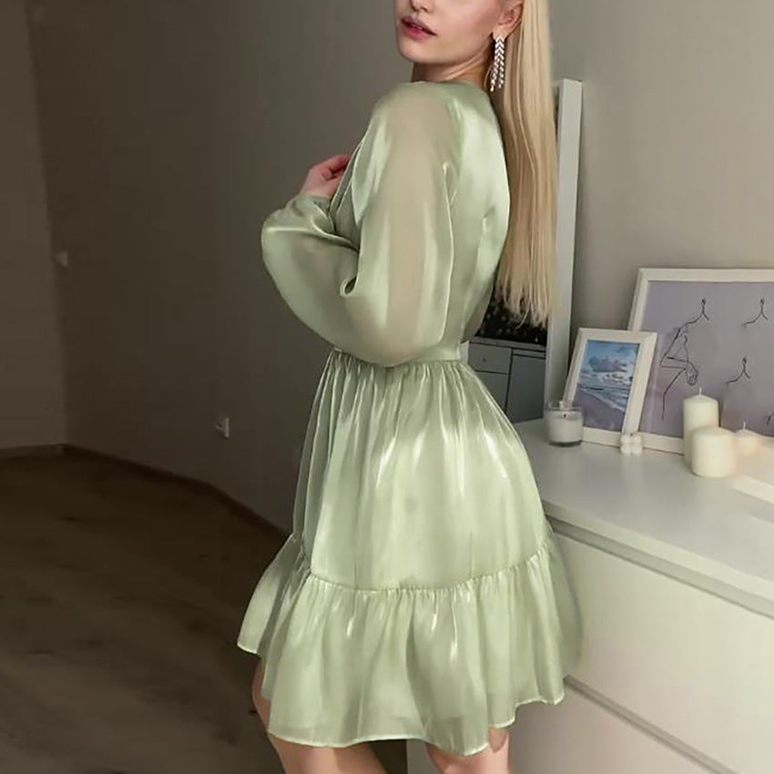 Green Sadhbh A-Line Mini Dress with V-Neck by Lumina Vancouver, showcasing a stylish and fitted silhouette with elegant details.