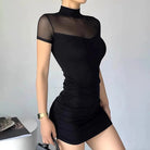 Black Berit Belle bodycon mini dress by Lumina Vancouver, fitted design with long sleeves, displayed on a hanger.