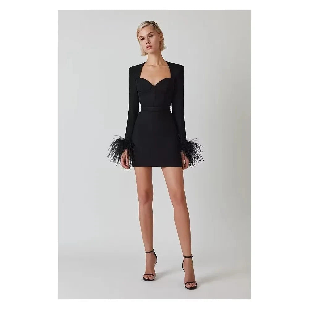 Black Nova mini cocktail dress by Lumina Vancouver, featuring a fitted silhouette and stylish design suitable for evening events.