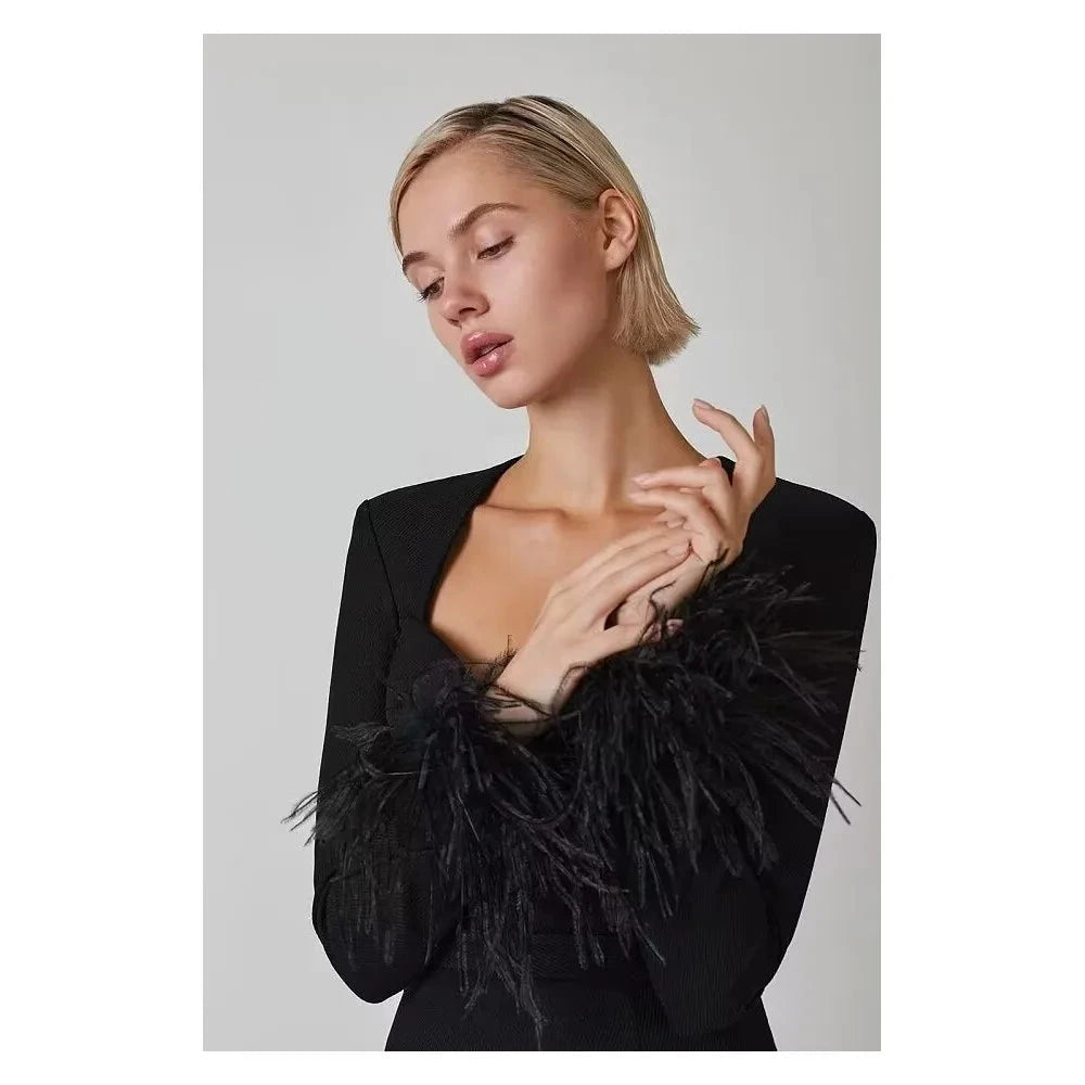 Black Nova mini cocktail dress by Lumina Wear, featuring a fitted silhouette and elegant design, perfect for evening occasions.