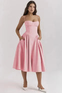 Pink Nova Corset Dress by Lumina Wear featuring a sweetheart neckline and midi length, displayed on a hanger.