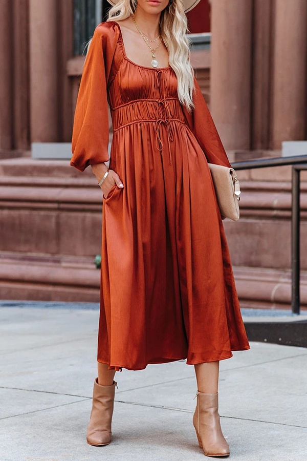 Orange Niamh Everyday Elegance midi dress by Lumina Vancouver, shown on a model with a fitted silhouette and stylish design.
