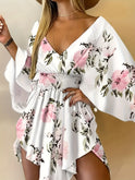 Lumina Wear Nova floral print mini dress with V-neck, featuring colorful mixed floral pattern, perfect for casual or summer wear.