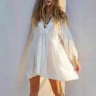 Lumina Vancouver Jacinta mini dress with sheer V-neck, stylish white mini dress featuring a fitted silhouette and elegant design.
