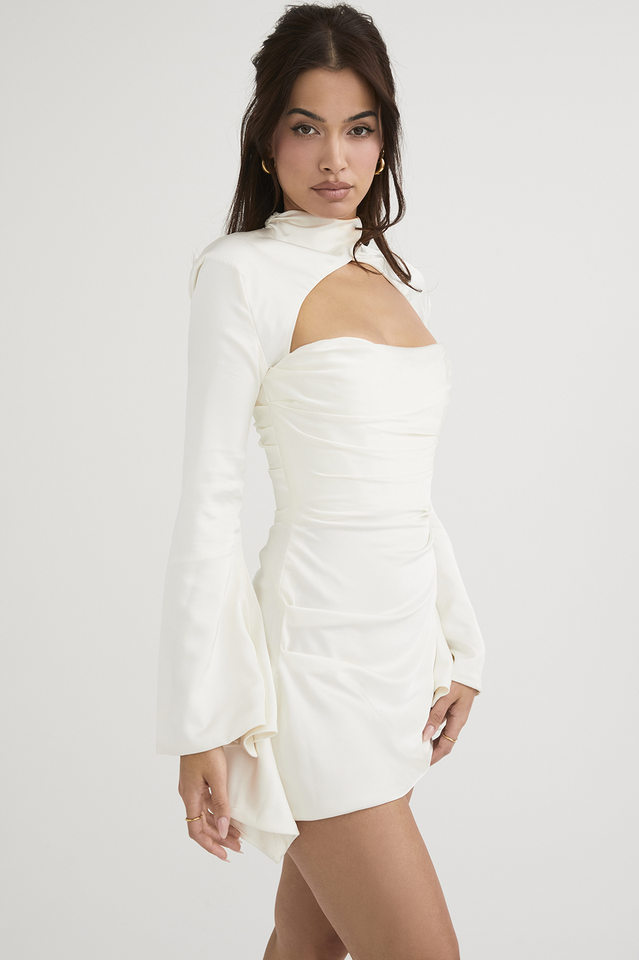 Lumina Wear Fionnuala satin mini dress with twisted neckline, ivory color, fitted style, shown on a model.