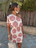 White and red Lumina Wear Nova one-shoulder asymmetrical mini dress with a stylish silhouette, perfect for modern fashion statements.