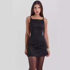 Black Verena Satin Mini Dress by Lumina Vancouver featuring a sleek, fitted design perfect for stylish occasions.