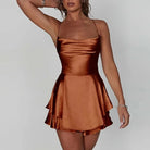 Green satin mini dress with cowl neck by Lumina Vancouver, featuring a sleek, fitted silhouette and elegant design.