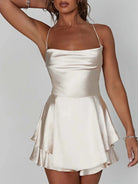 Green satin mini dress with cowl neck from Lumina Vancouver, featuring a sleek, fitted design and elegant style.