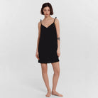 Black Carys satin slip dress by Lumina Vancouver, mini dress style, showing smooth satin fabric and fitted design.